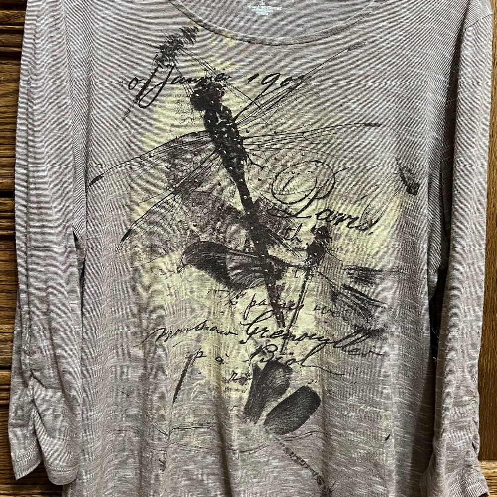 Kim Rogers, 3/4 sleeve Large brownish color shirt, dragonfly design on front